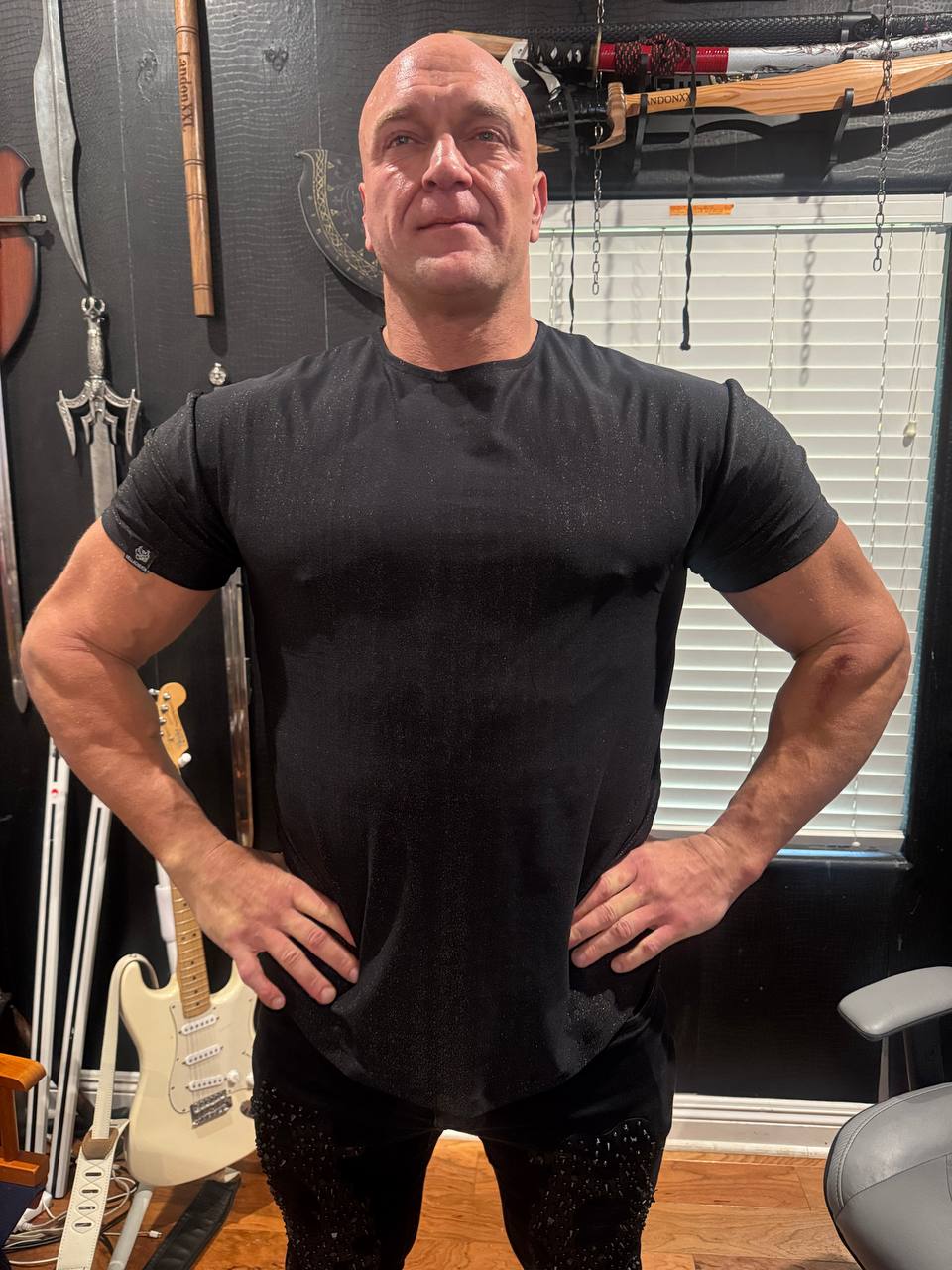 Black performance crewneck T‑shirt in nylon spandex Lurex fabric with a fitted athletic silhouette and subtle shimmer finish